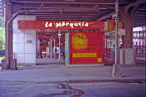 The entrance to La Marqueta public market beneath an elevated railway in East Harlem