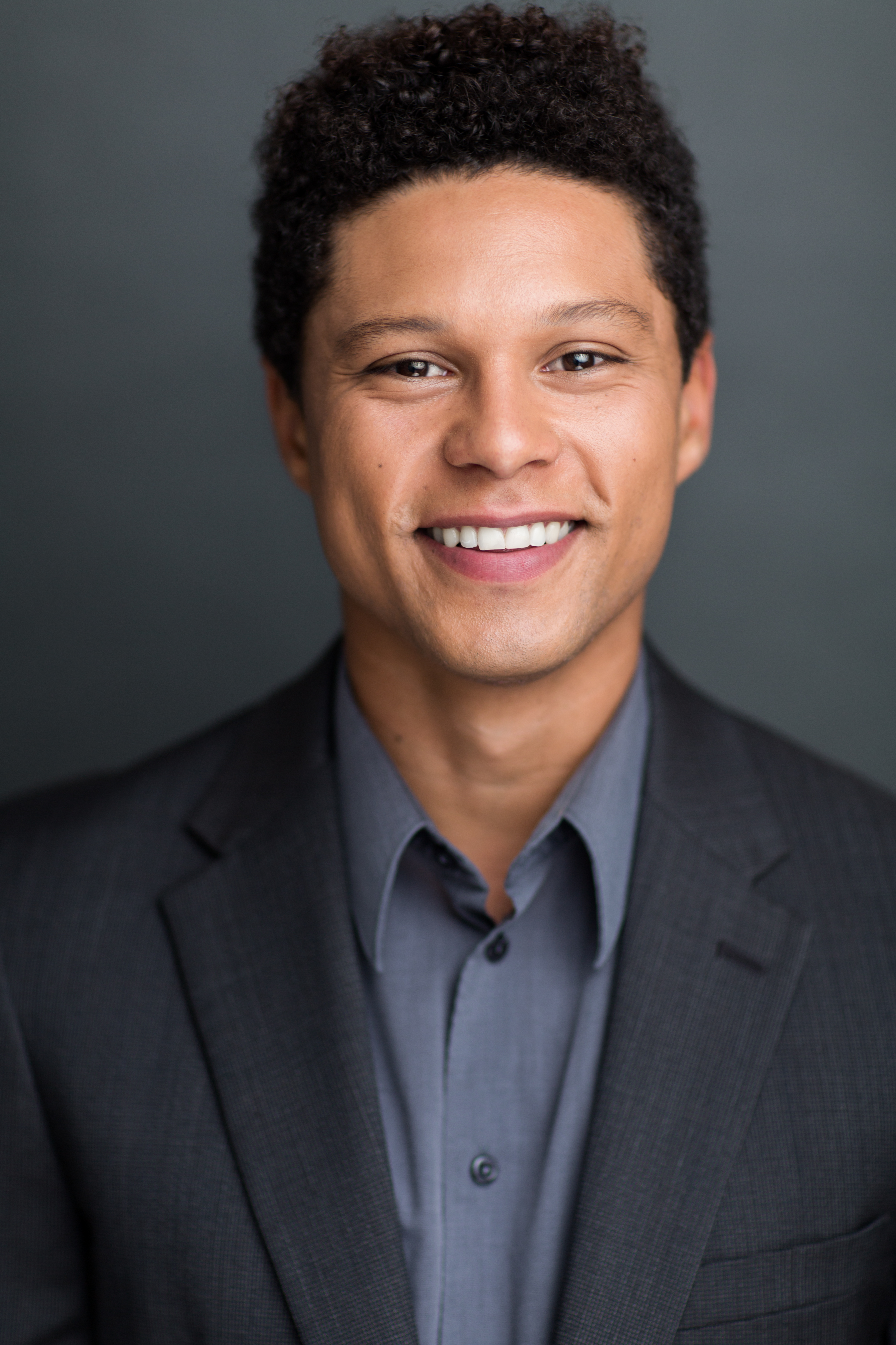 Portrait of Parris J. Williams against a dark grey background